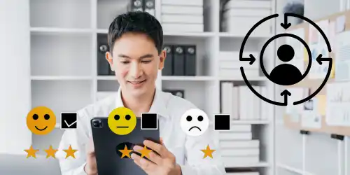 A person sitting at a desk with five smiley faces around them